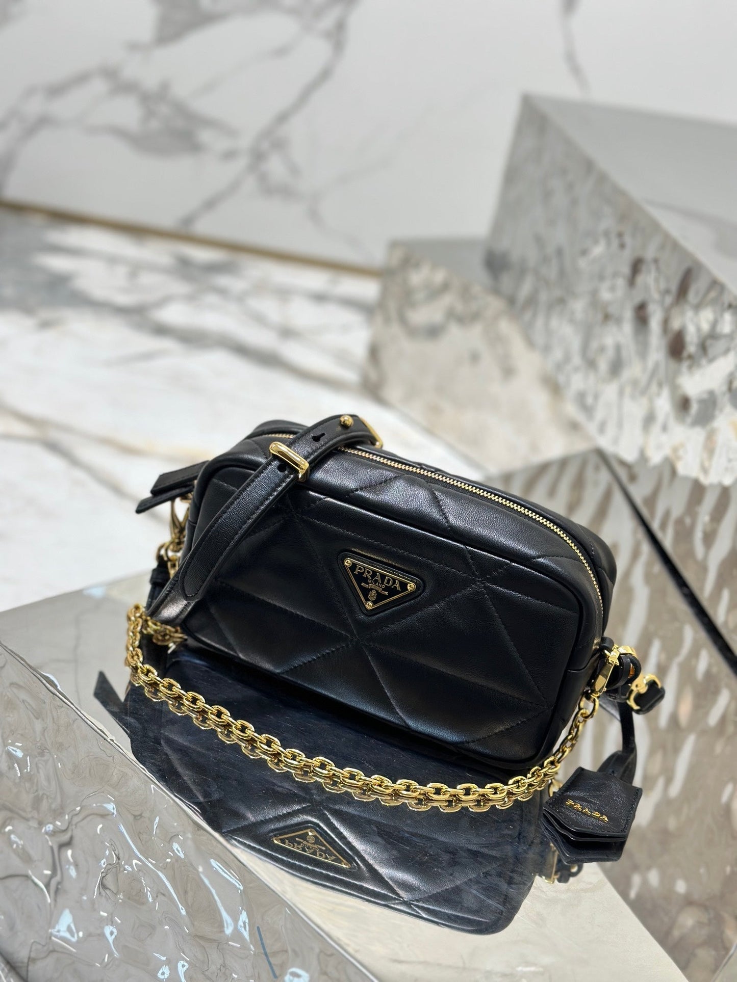 Luxury PradaCAMERA BAG 22 IN BLACK TRIANGLE PATTERN QUILTED LAMBSKIN GOLD HARDWARE