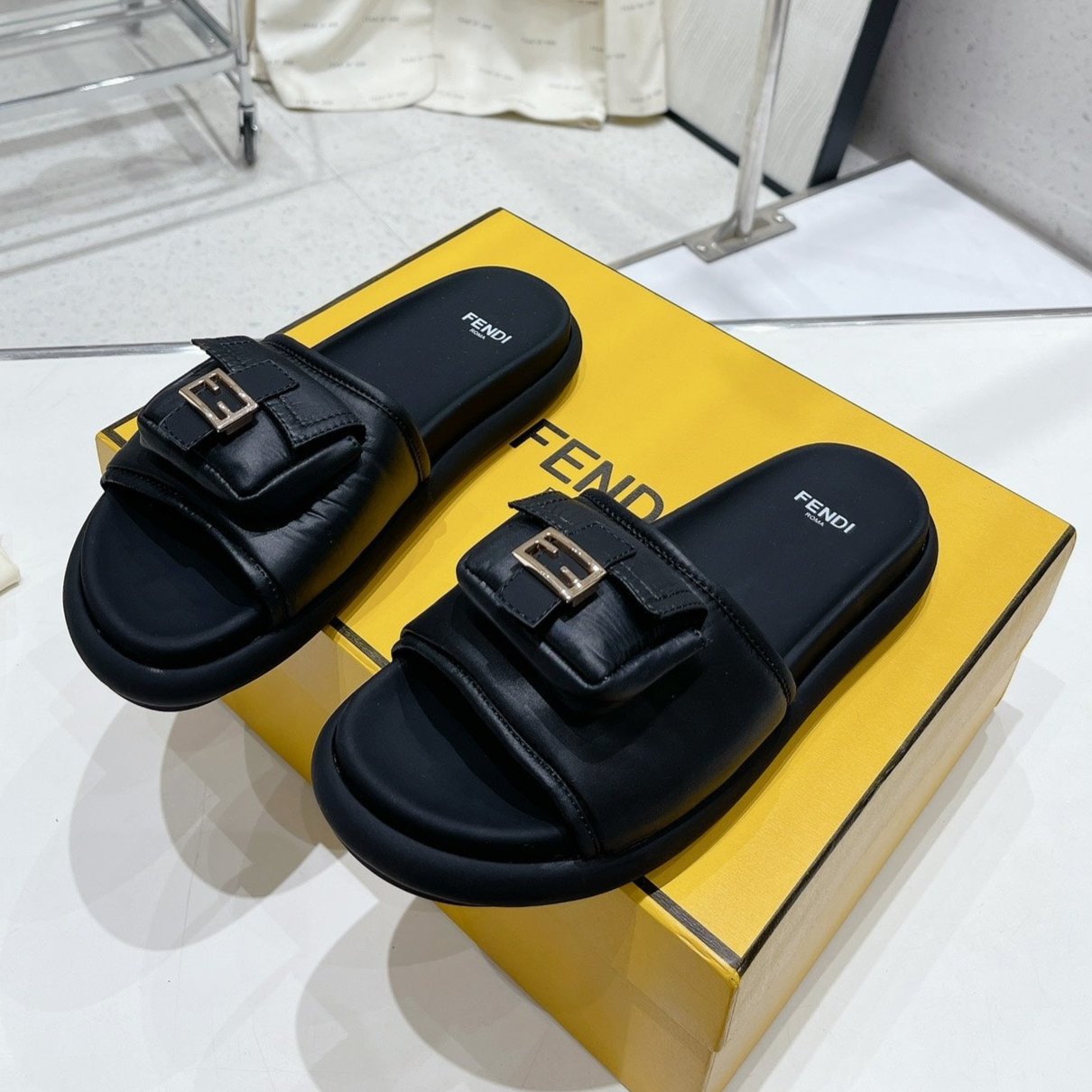 Luxury FendiLuxury FendiBAGUETTE SLIPPERS IN BLACK LAMBSKIN WITH GOLD HARDWARE