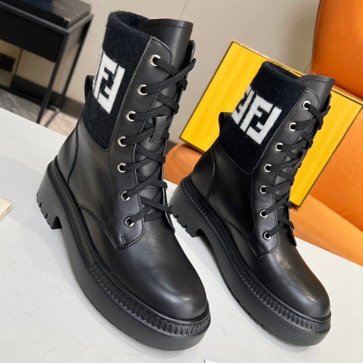 Luxury FendiLuxury FendiMARTIN BOOTS IN BLACK CALFSKIN AND FUR