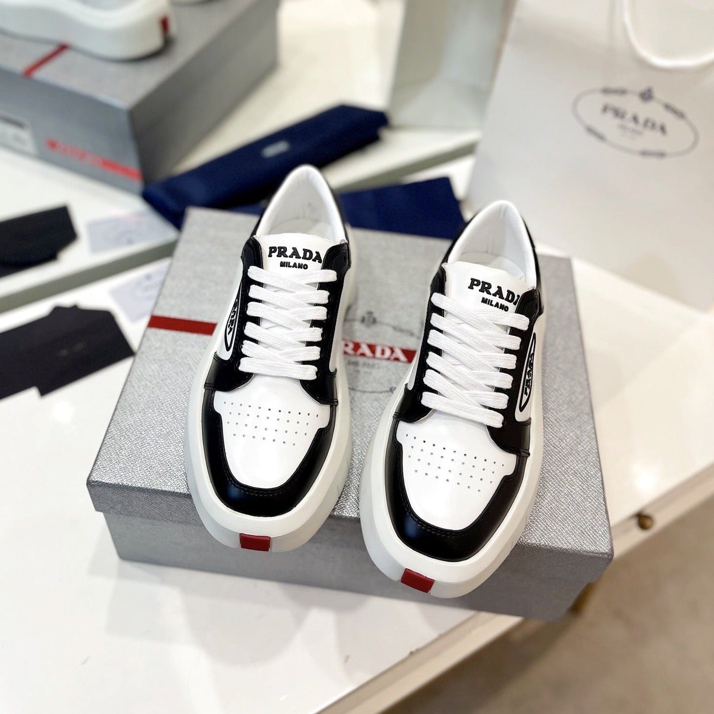 Luxury PradaDOWNTOWN THICK-SOLE SNEAKERS BLACK AND WHITE CALFSKIN