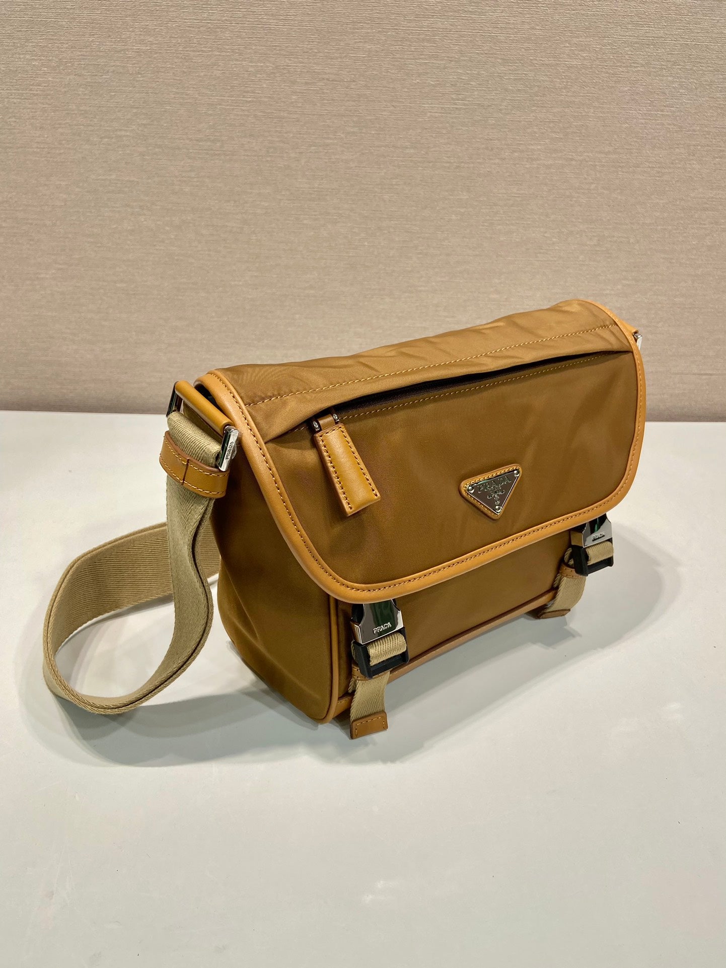 Luxury PradaSMALL FLAP BAG 20 IN CIDER BROWN RE-NYLON AND CALFSKIN TRIM