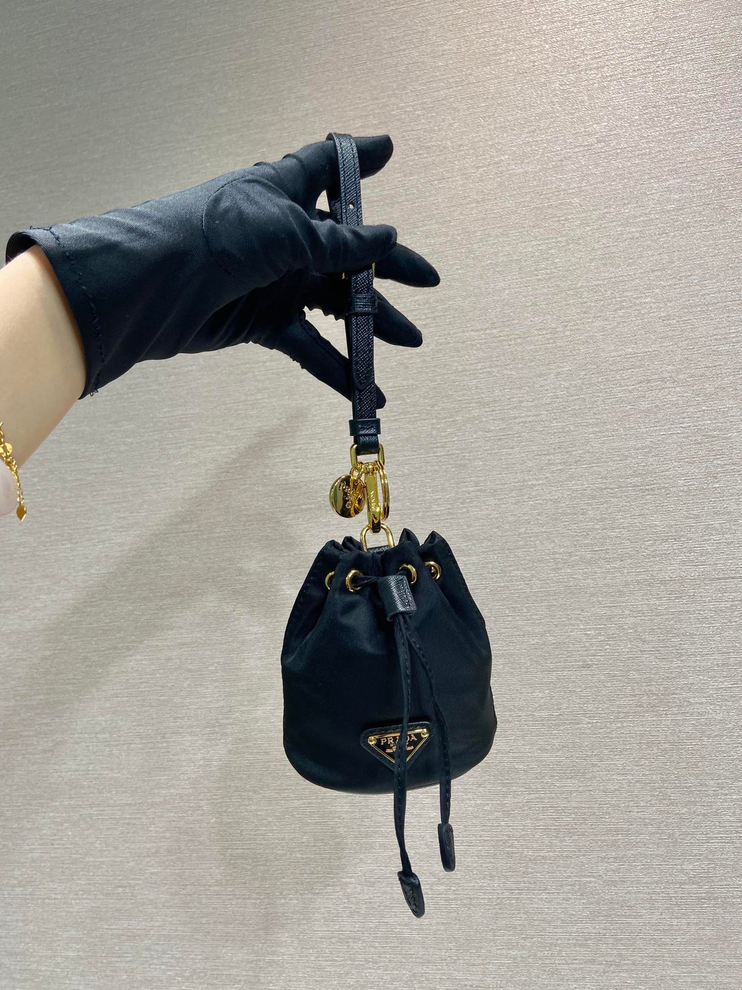Luxury PradaMINI BUCKET BAG 10 IN BLACK RE-NYLON AND SAFFIANO LEATHER STRAP
