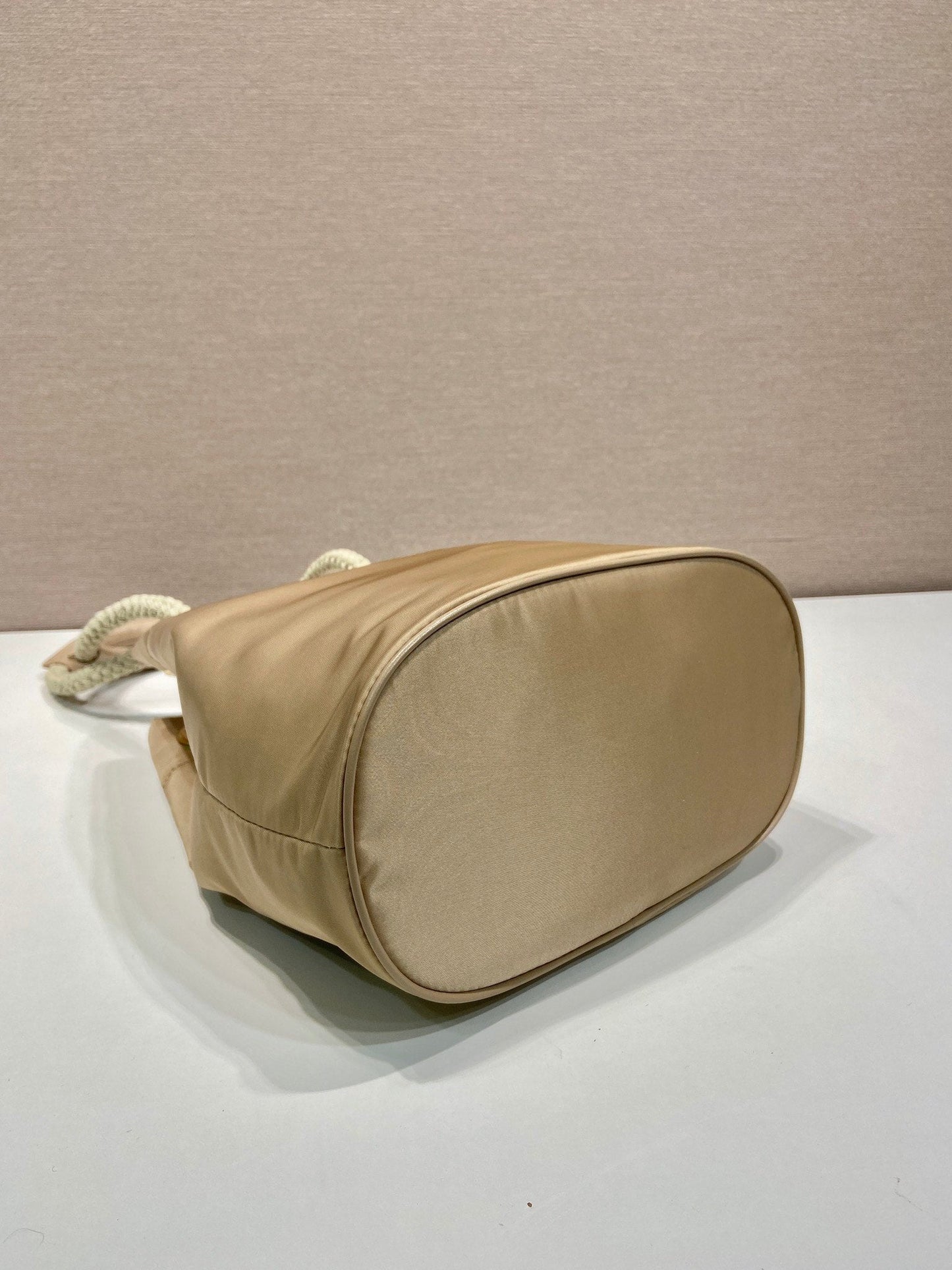 Luxury PradaBUCKET BAG 28 IN BEIGE RE-NYLON GOLD LOGO