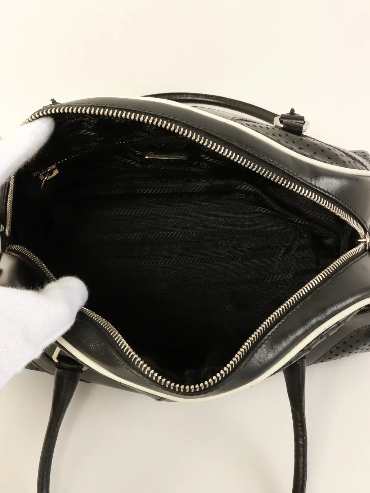 Luxury PradaPunching Leather Logo Embossed Top Handle Bag Black