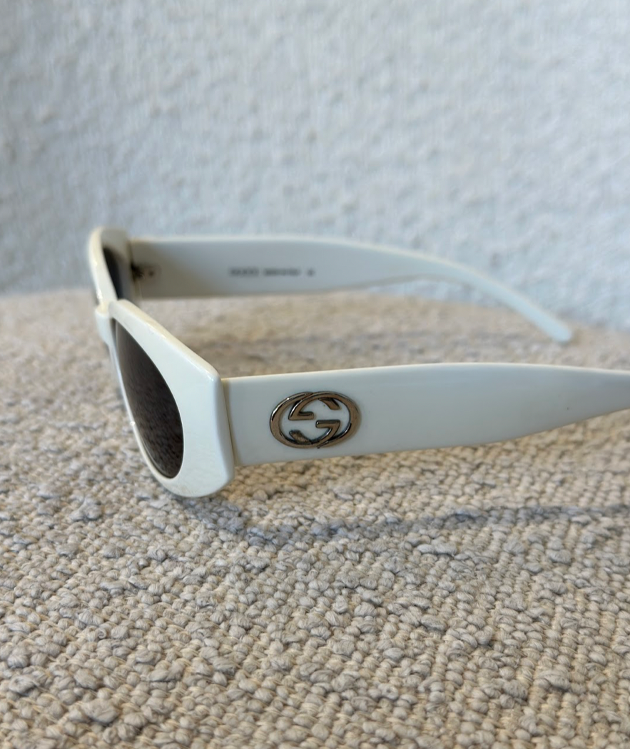 Luxury Gucci White Oval Sunglasses with Logo Detail