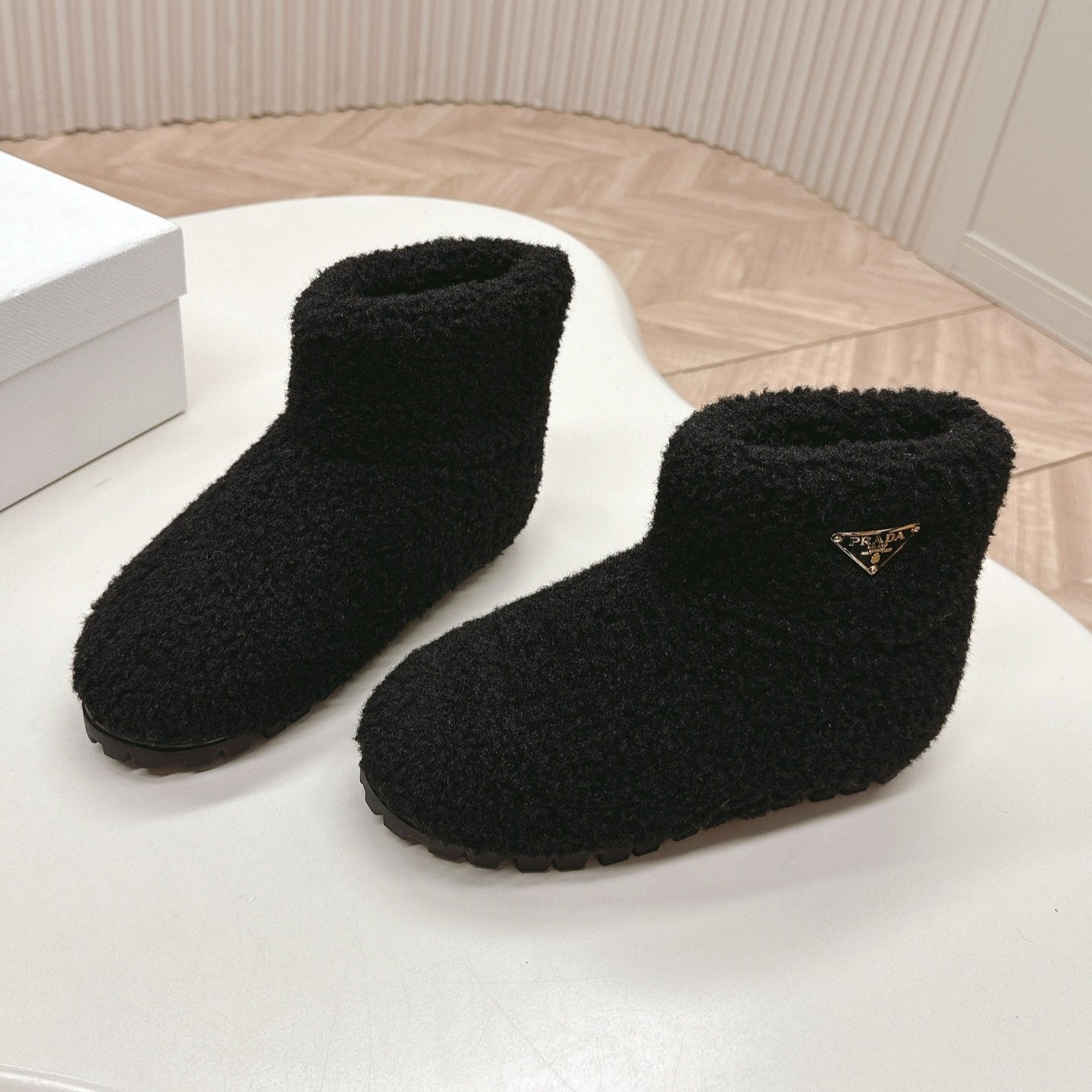 Luxury PradaSNOW ANKLE BOOTS IN BLACK SHEARLING