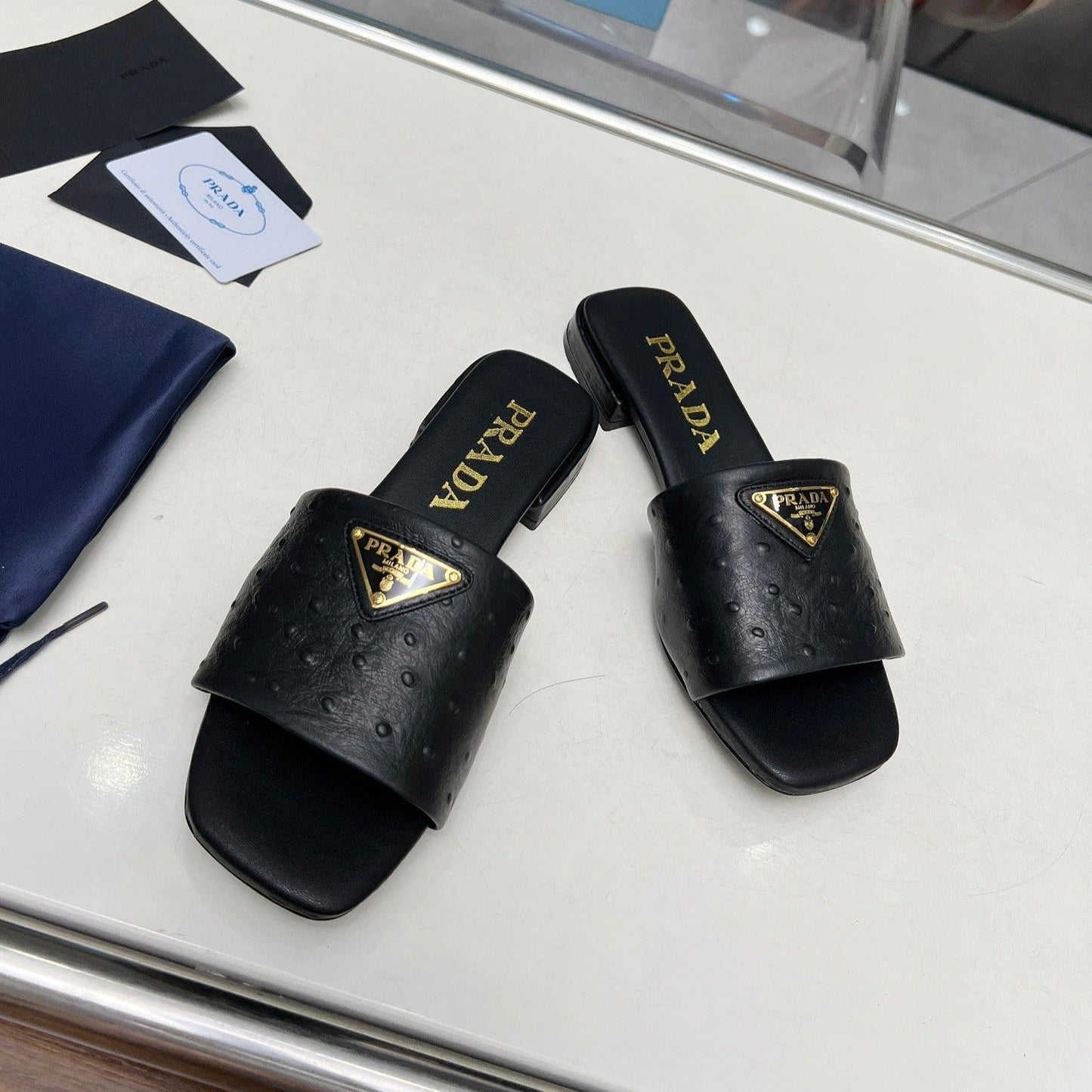 Luxury PradaSAFFIANO PATENT SLIDES OSTRICH MOTIF BLACK CALFSKIN