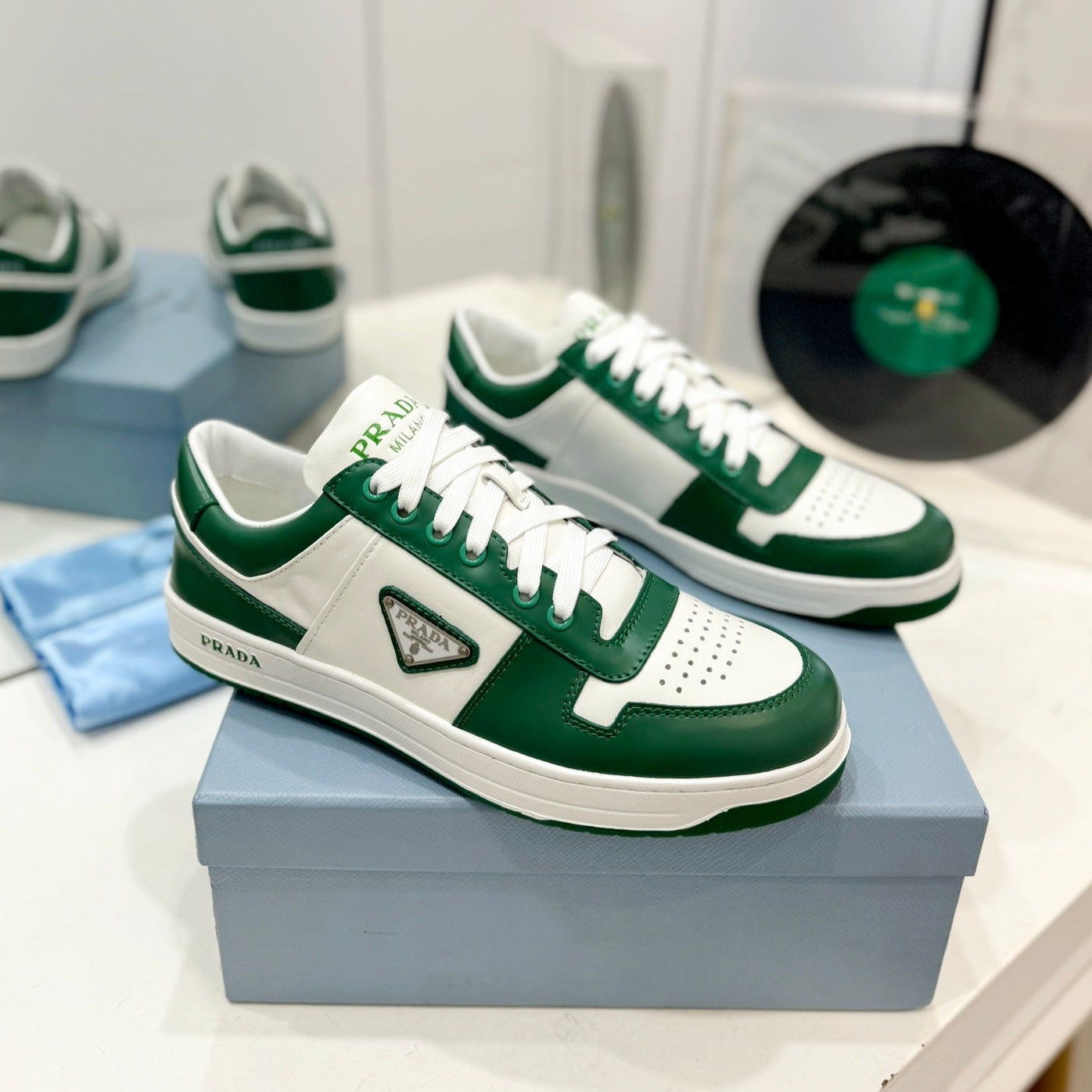 Luxury PradaDOWNTOWN PERFORATED SNEAKERS WHITE AND GREEN CALFSKIN