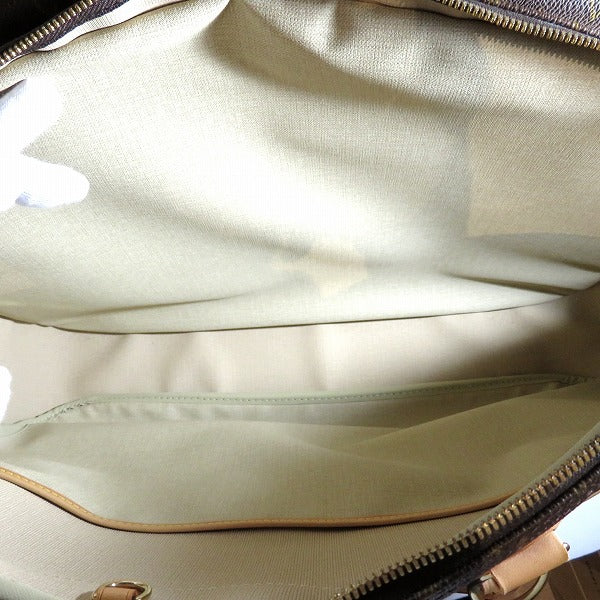 Louis Vuitton Monogram Alize 24H Bag M41399