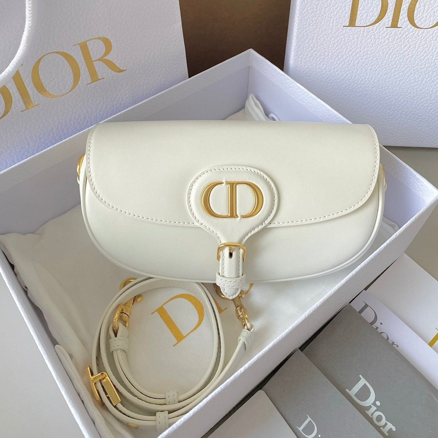 Luxury Diormedium east west bobby 22cm white calfskin ghw
