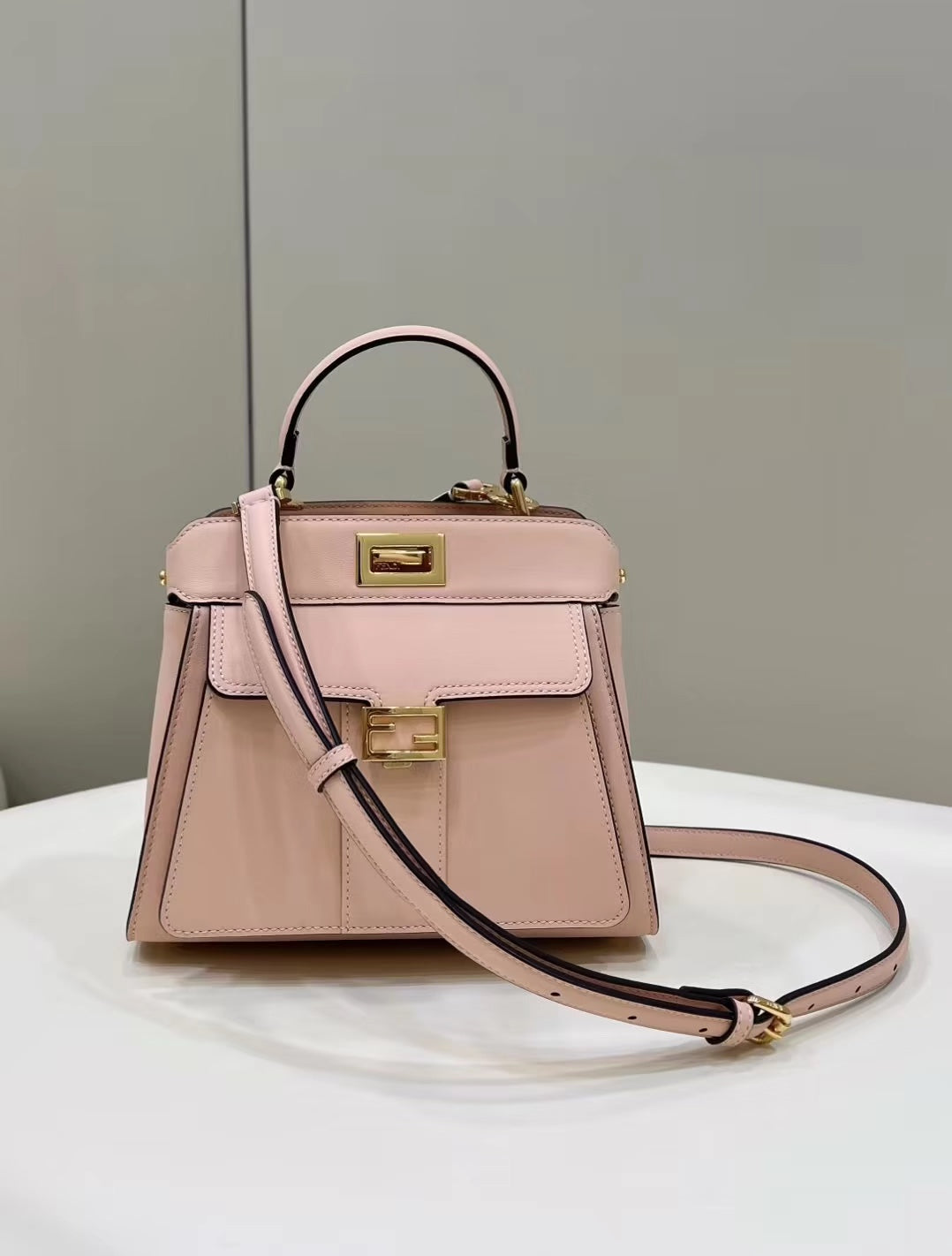 Luxury FendiLuxury FendiPEEKABOO MINI 23 BAG IN LIGHT PINK CALFSKIN WITH GOLD HARDWARE