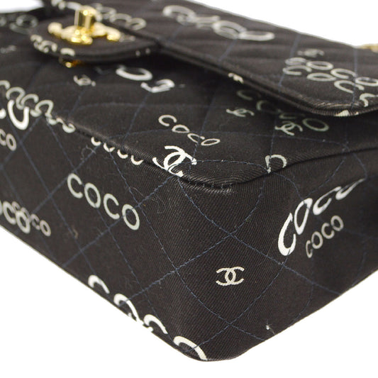 CHANEL 2001-2003 COCO patterned Classic Double Flap Medium Black Canvas 47523