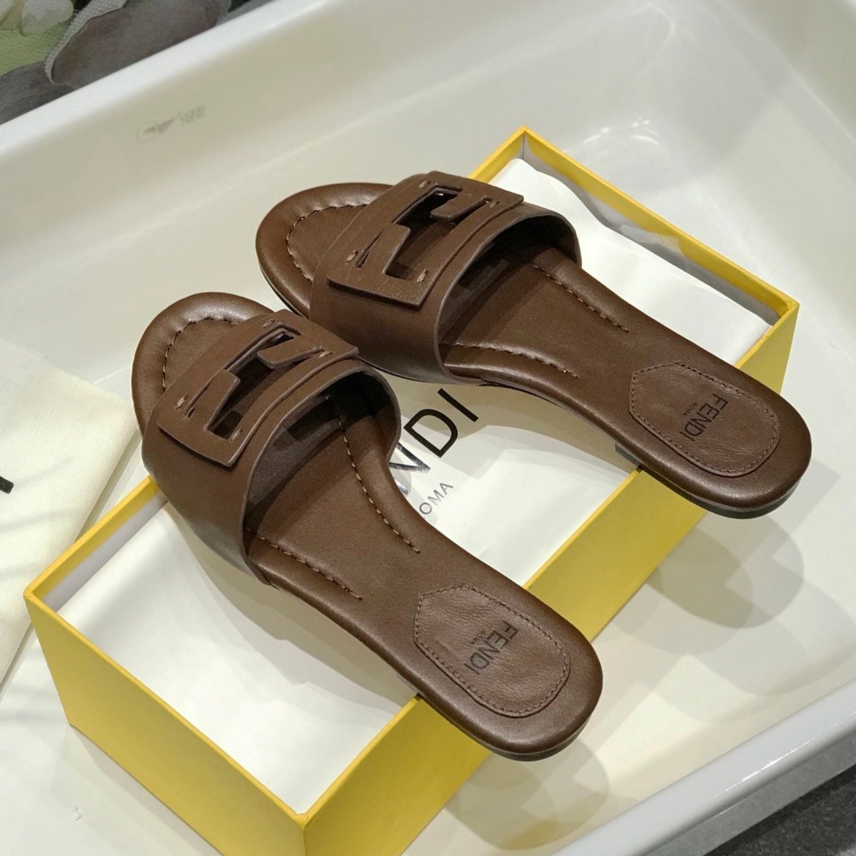 Luxury FendiLuxury FendiBAGUETTE SLIDES IN COFFEE BROWN LAMBSKIN