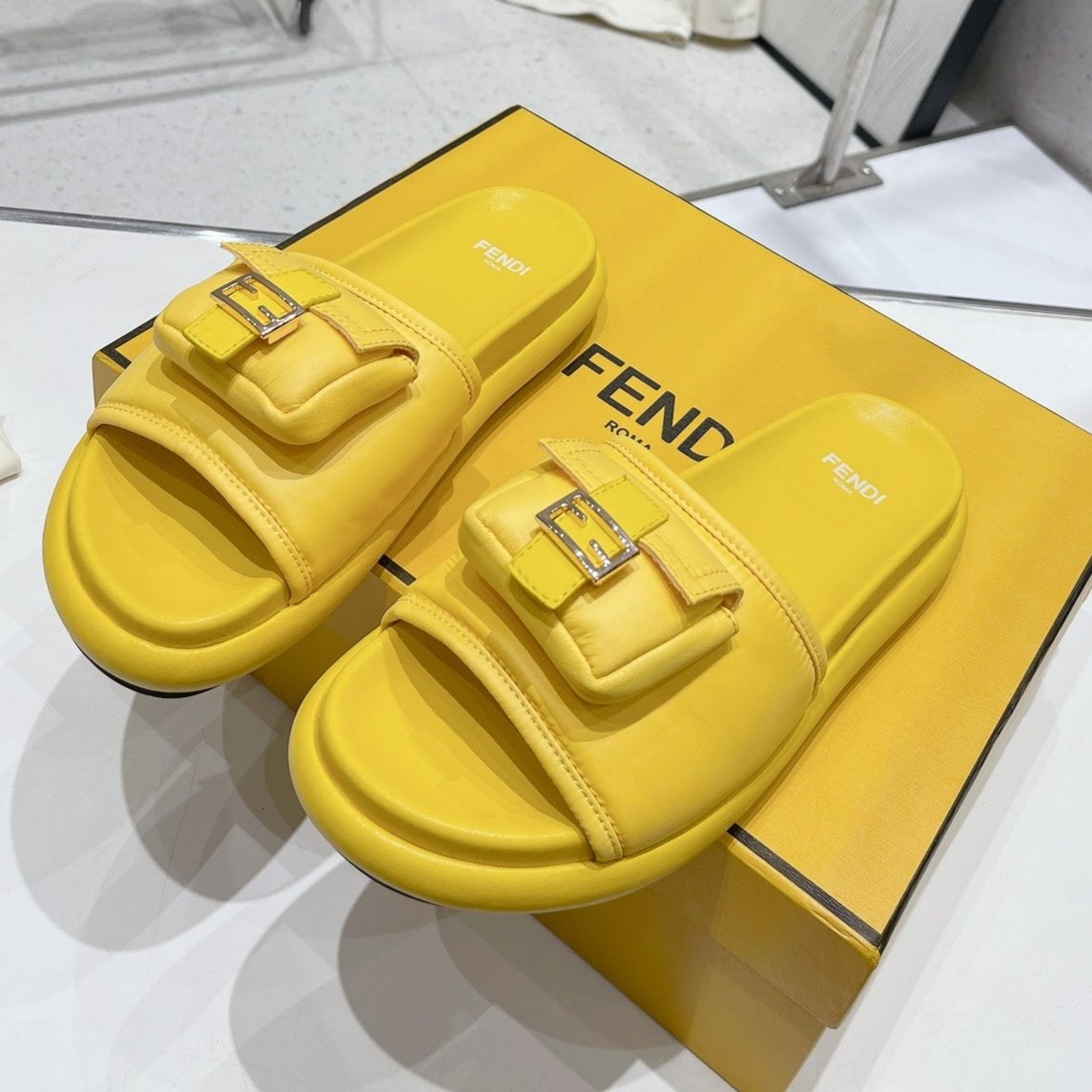 Luxury FendiLuxury FendiBAGUETTE SLIPPERS IN NAPLES YELLOW LAMBSKIN WITH GOLD HARDWARE