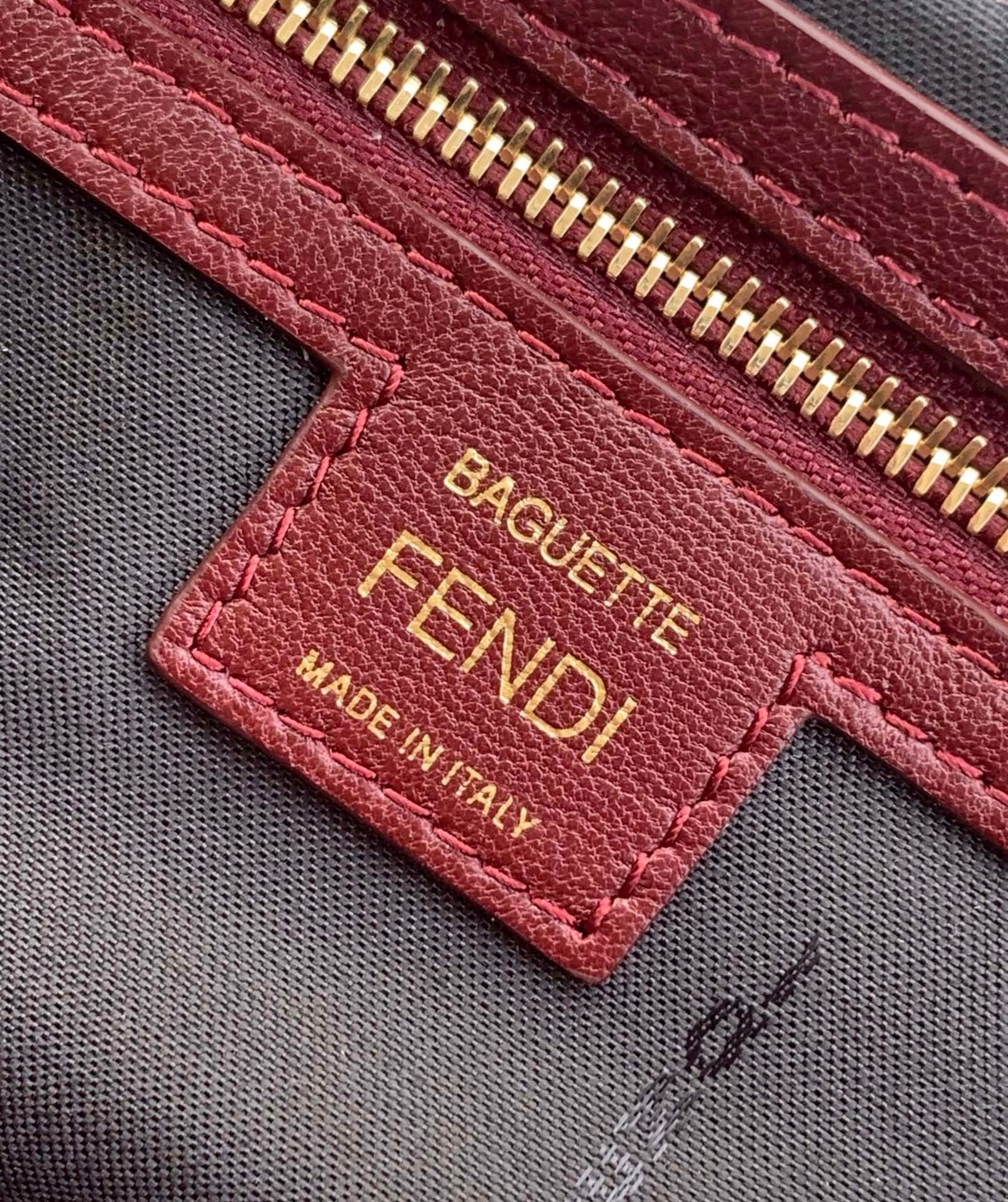 Luxury FendiFend Baguette 27 Bag With FF Motif Burgundy Leather Ghw