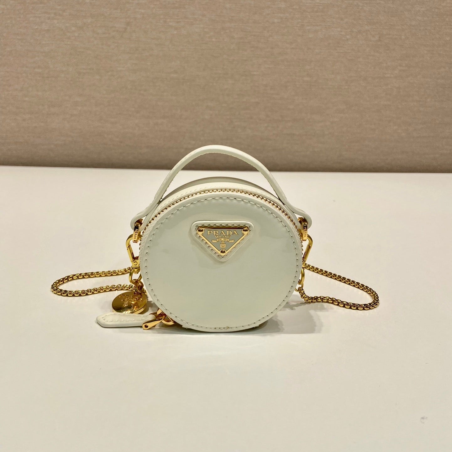 Luxury PradaMINI ROUND BAG 8 IN WHITE GLOSSY CALFSKIN GOLD HARDWARE