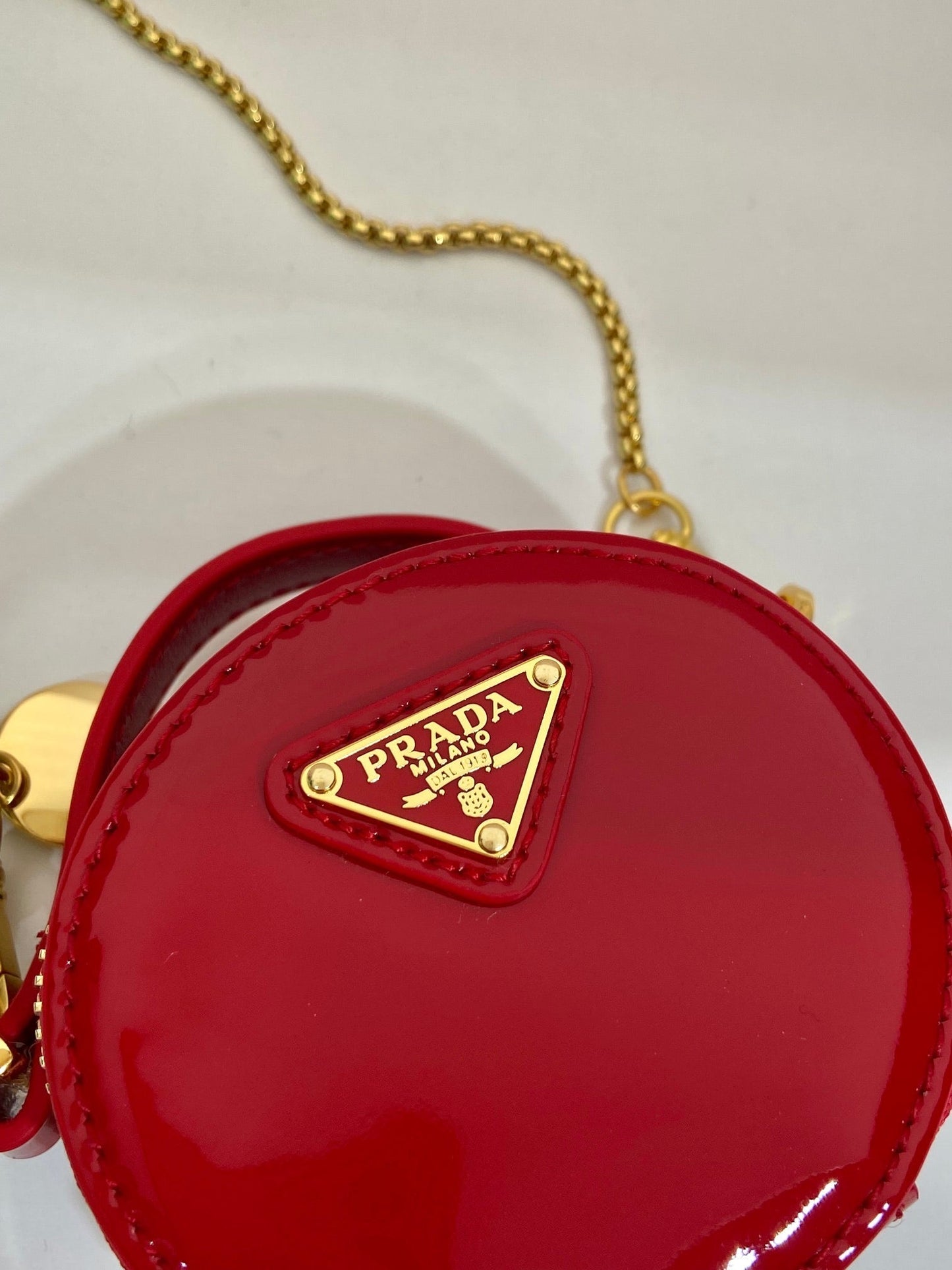 Luxury PradaMINI ROUND BAG 8 IN RED GLOSSY CALFSKIN GOLD HARDWARE