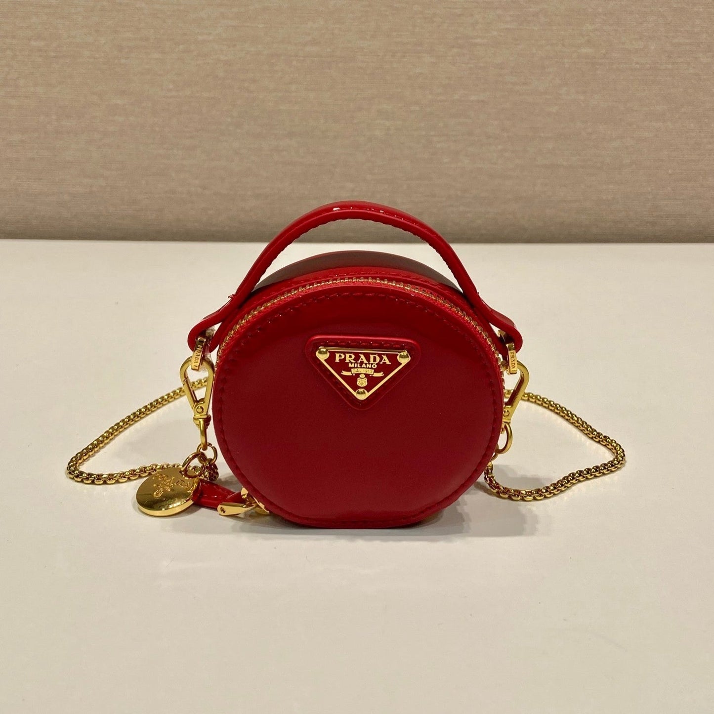 Luxury PradaMINI ROUND BAG 8 IN RED GLOSSY CALFSKIN GOLD HARDWARE