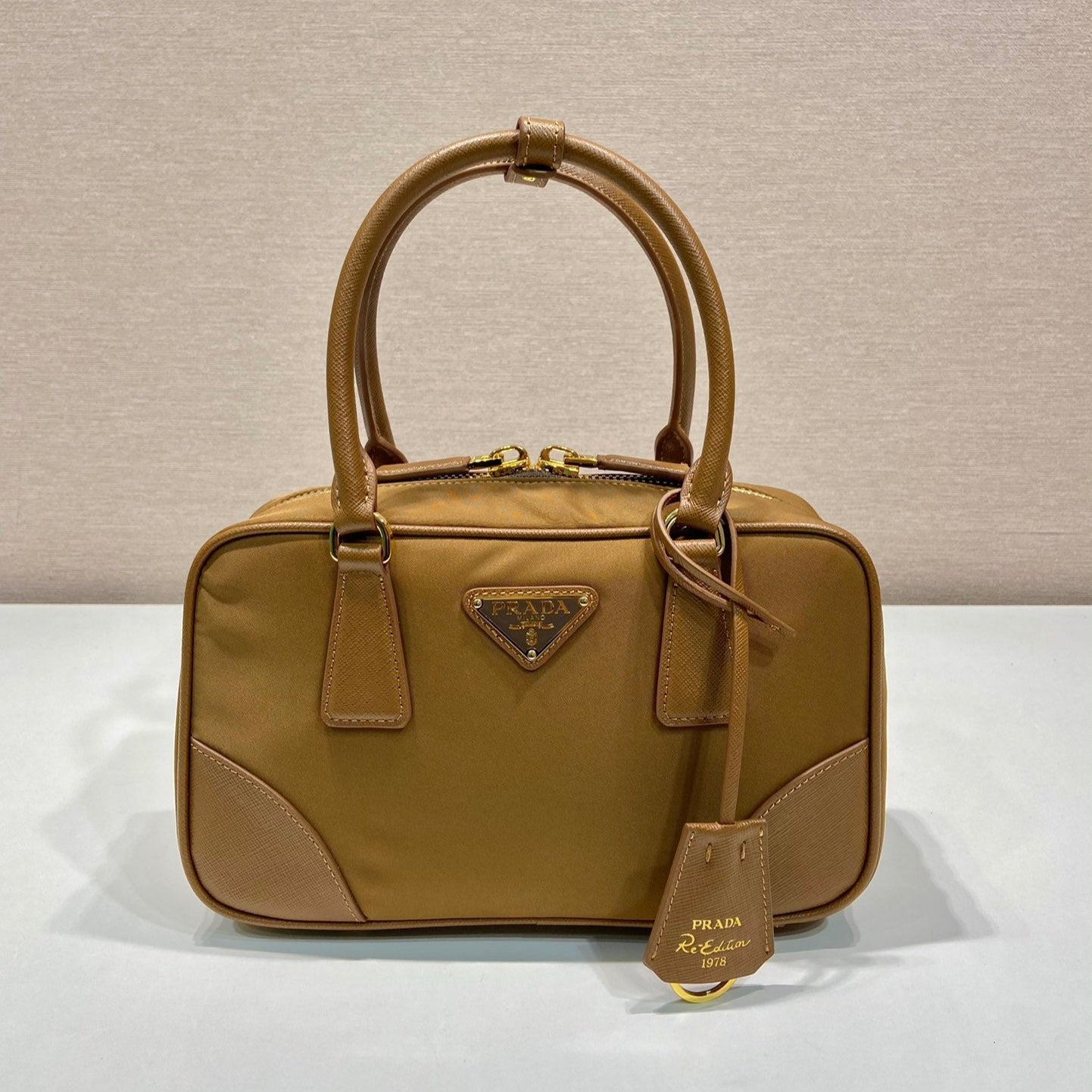 Luxury PradaSMALL TOP HANDLE BAG 25 IN GOLDEN BROWN NYLON AND CALFSKIN TRIM