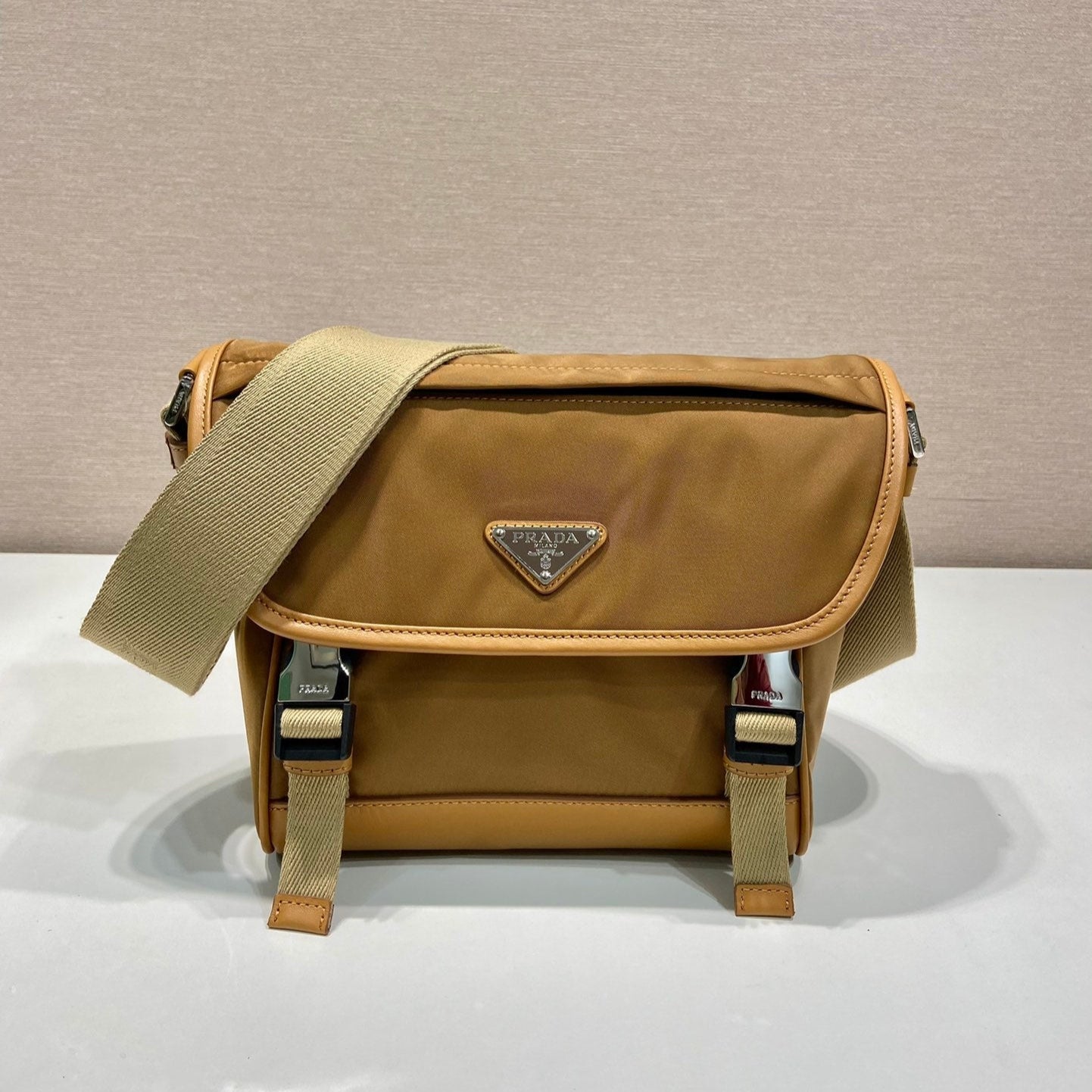 Luxury PradaSMALL FLAP BAG 20 IN CIDER BROWN RE-NYLON AND CALFSKIN TRIM