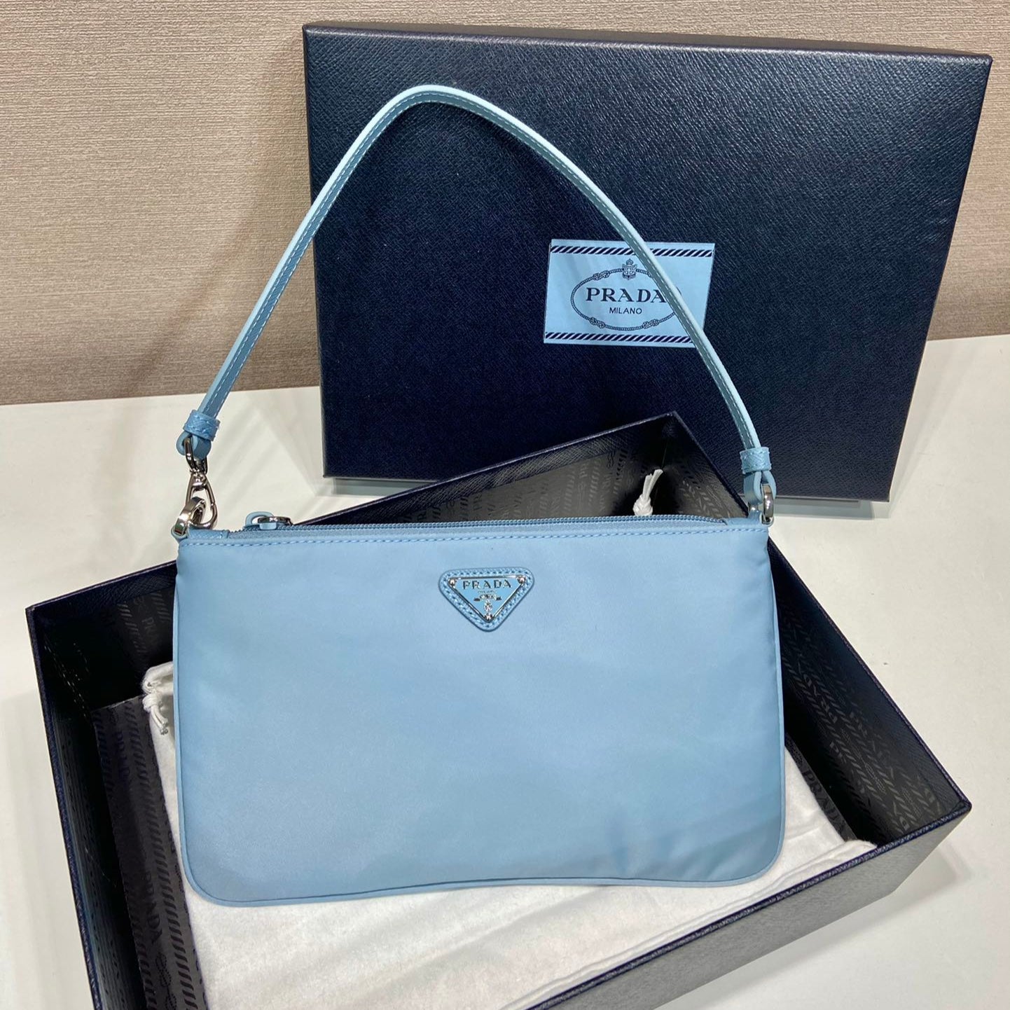 Luxury PradaSHOULDER BAG 24 WITH TRIANGLE LOGO IN SKY BLUE RE-NYLON FABRIC