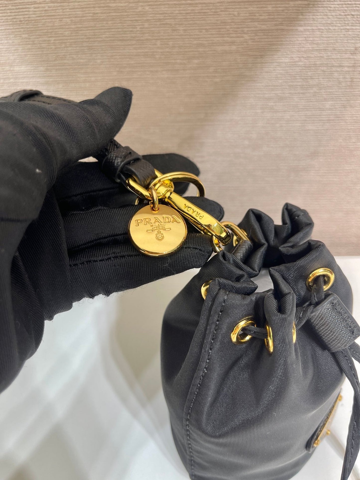 Luxury PradaMINI BUCKET BAG 10 IN BLACK RE-NYLON AND SAFFIANO LEATHER STRAP