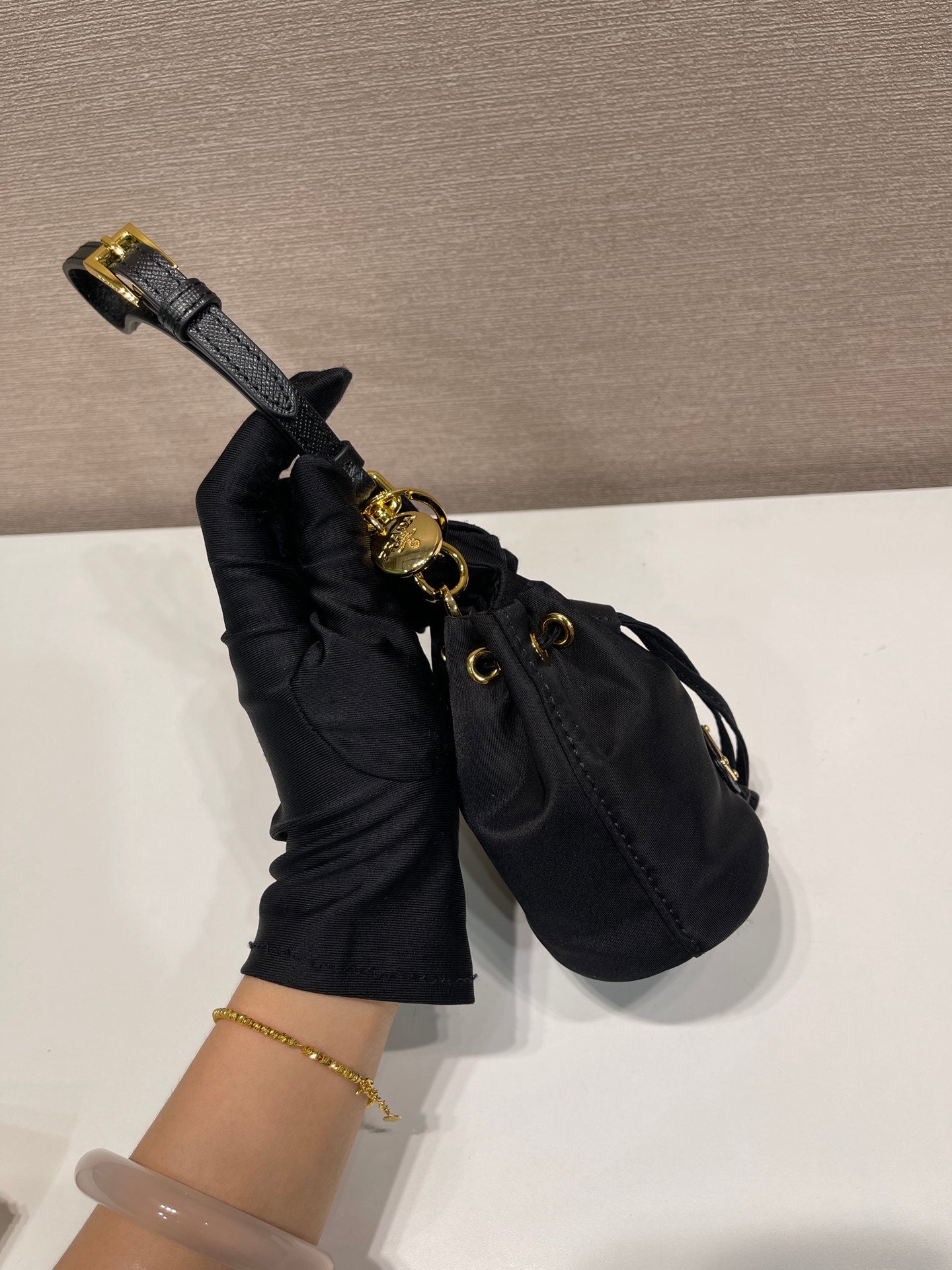 Luxury PradaMINI BUCKET BAG 10 IN BLACK RE-NYLON AND SAFFIANO LEATHER STRAP