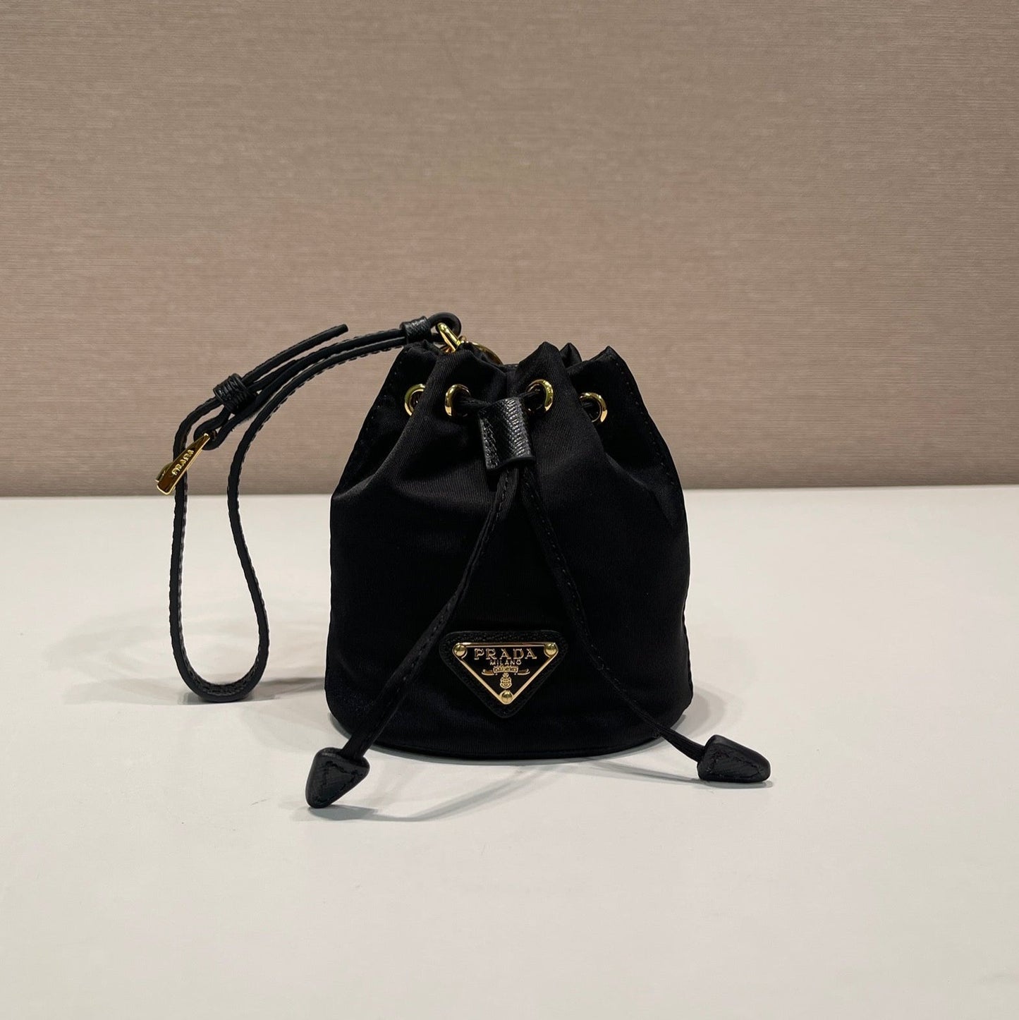Luxury PradaMINI BUCKET BAG 10 IN BLACK RE-NYLON AND SAFFIANO LEATHER STRAP