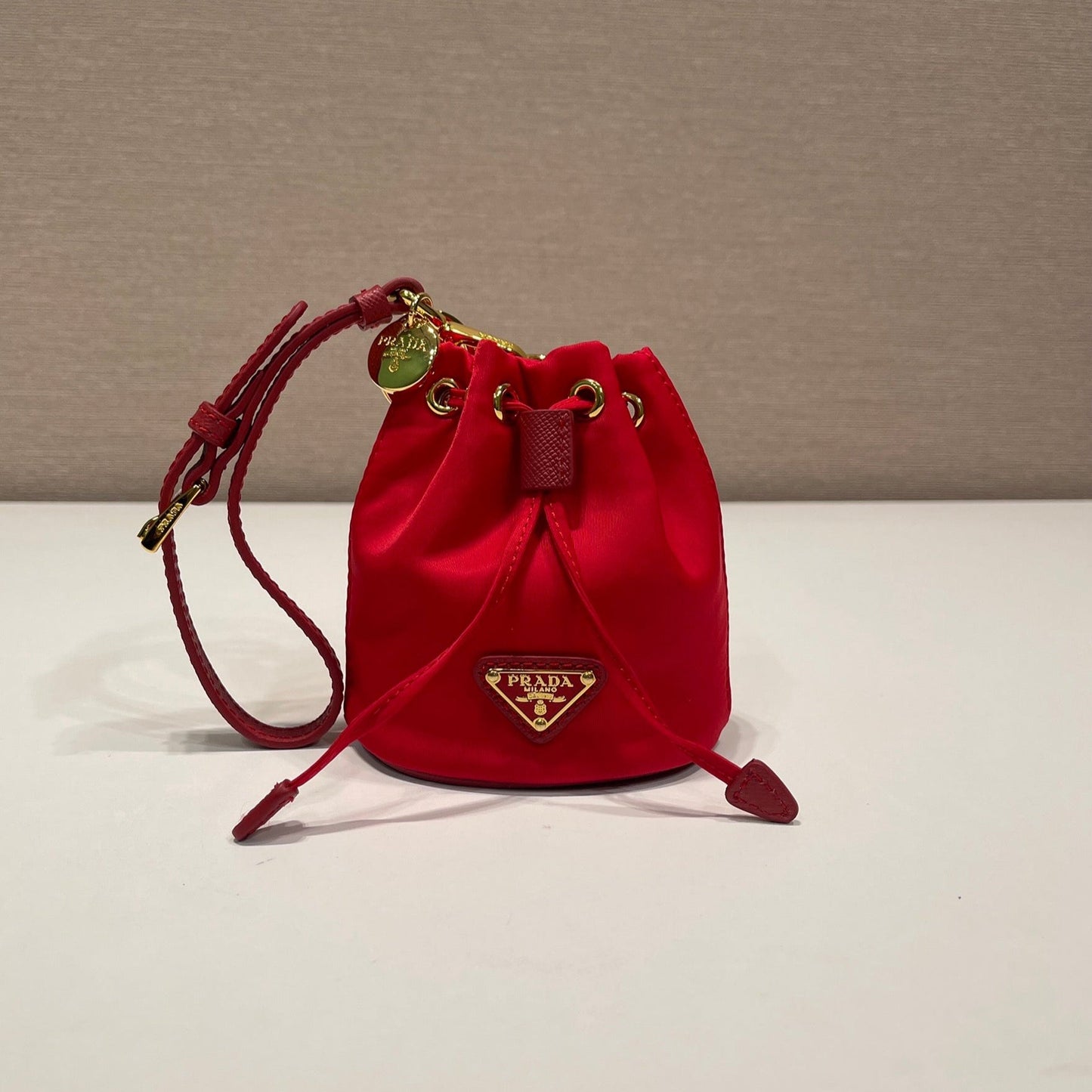 Luxury PradaMINI BUCKET BAG 10 IN RED RE-NYLON AND SAFFIANO LEATHER STRAP