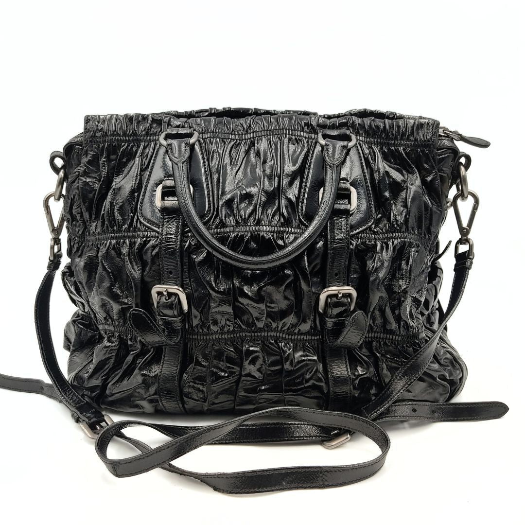 Luxury PradaShopper shoulder bag in black Gaufre paint