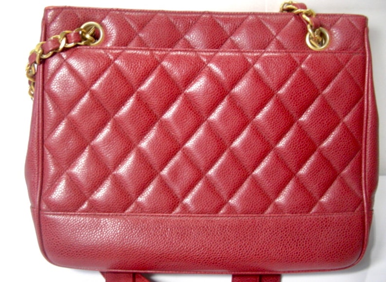 Luxury Chanel Vintage cherry red caviar leather quilted shoulder bag, tote with golden CC ball and chain straps