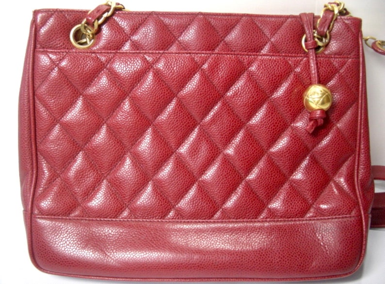 Luxury Chanel Vintage cherry red caviar leather quilted shoulder bag, tote with golden CC ball and chain straps