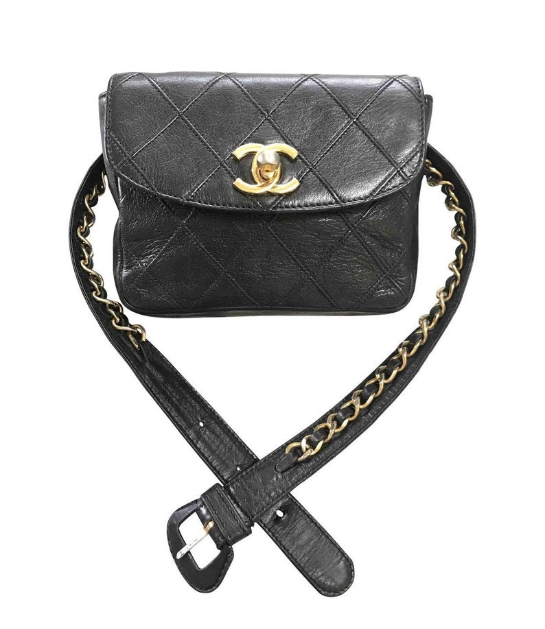 Luxury Chanel Vintage black leather waist purse, fanny pack with golden chain belt and CC closure hock