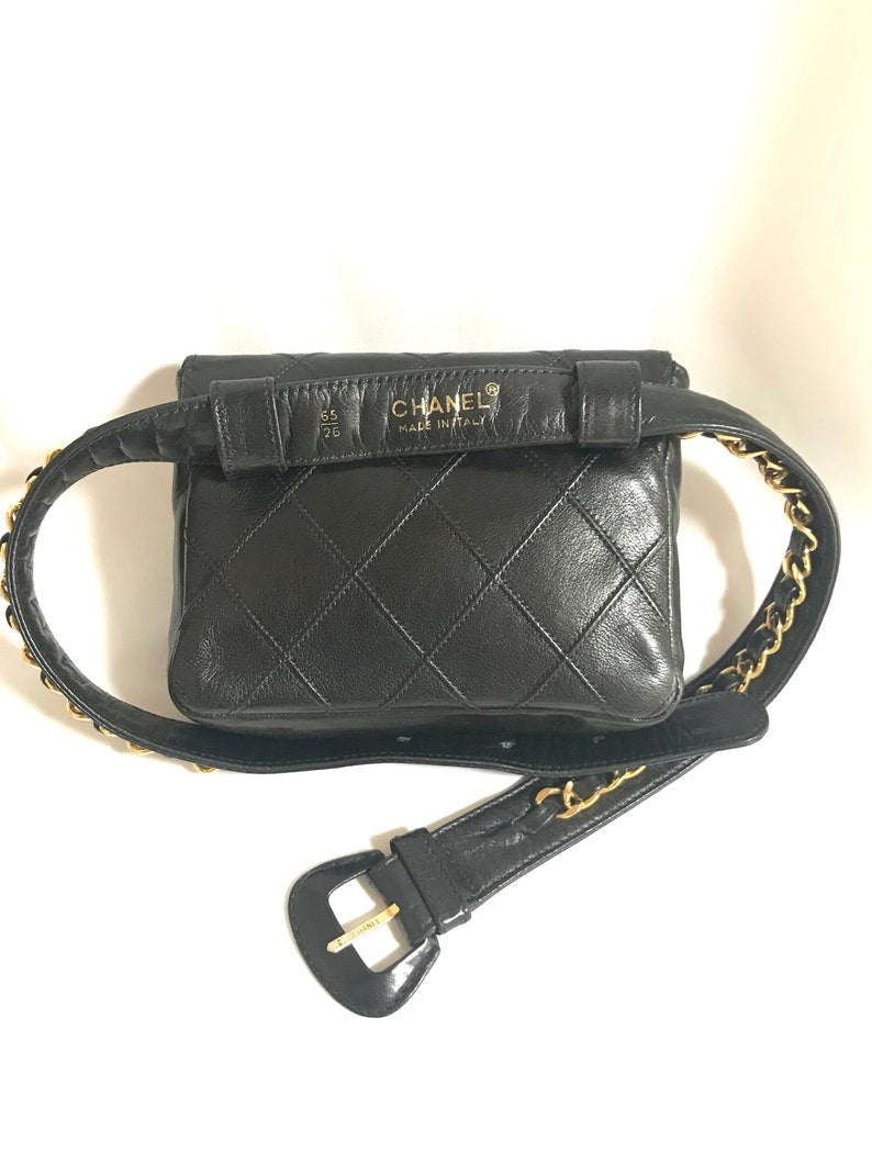 Luxury Chanel Vintage black leather waist purse, fanny pack with golden chain belt and CC closure hock