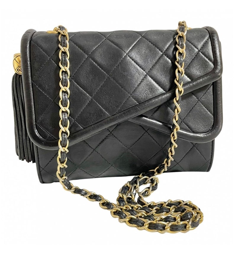 Luxury Chanel Vintage black fringe camera bag with double flaps