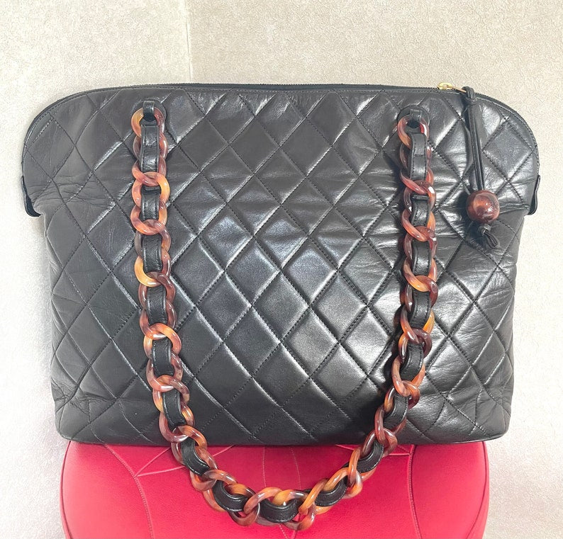 Luxury Chanel Vintage black lambskin large tote bag with brown plastic chains and CC mark charm to the LAMPO zipper