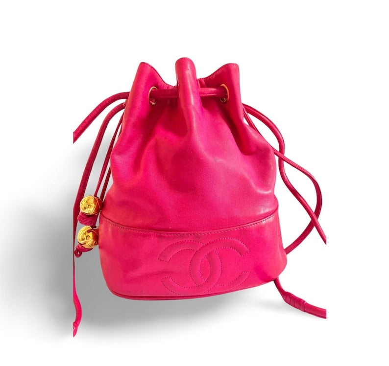 Luxury Chanel Vintage fusia pink lambskin hobo bucket shoulder bag with CC golden balls and CC stitch mark