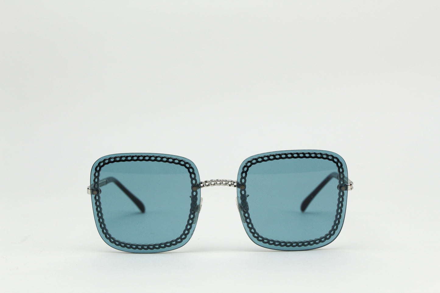 Chanel blue square chain around sunglasses