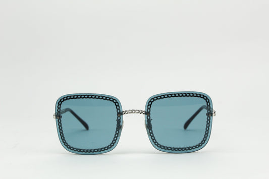 Chanel blue square chain around sunglasses