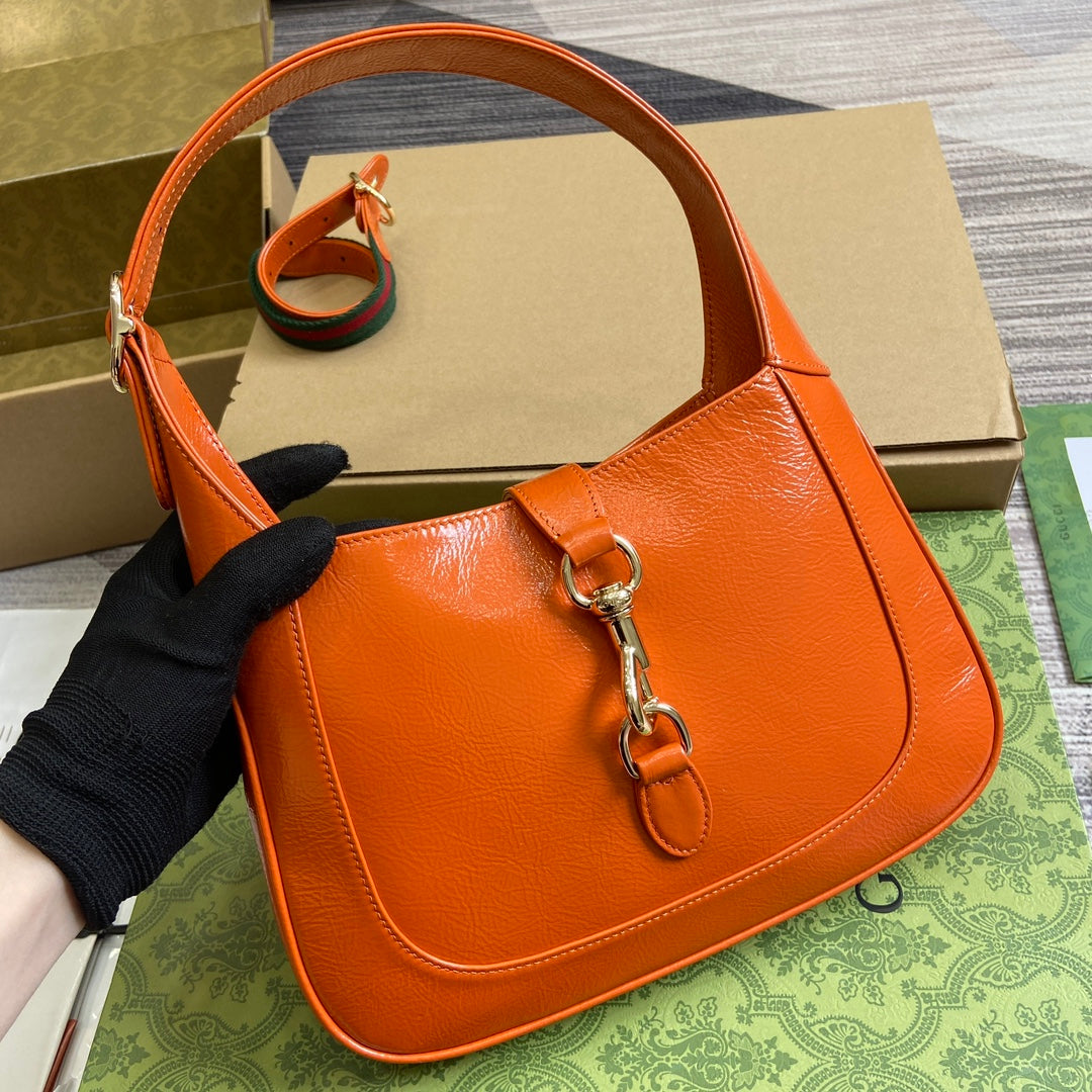Luxury Gucci JACKIE SMALL SHOULDER BAG 27 IN ORANGE CRACKED LACQUER CALFSKIN GOLD HARDWARE