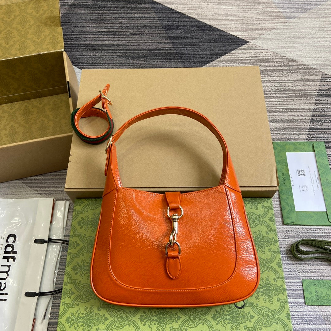 Luxury Gucci JACKIE SMALL SHOULDER BAG 27 IN ORANGE CRACKED LACQUER CALFSKIN GOLD HARDWARE