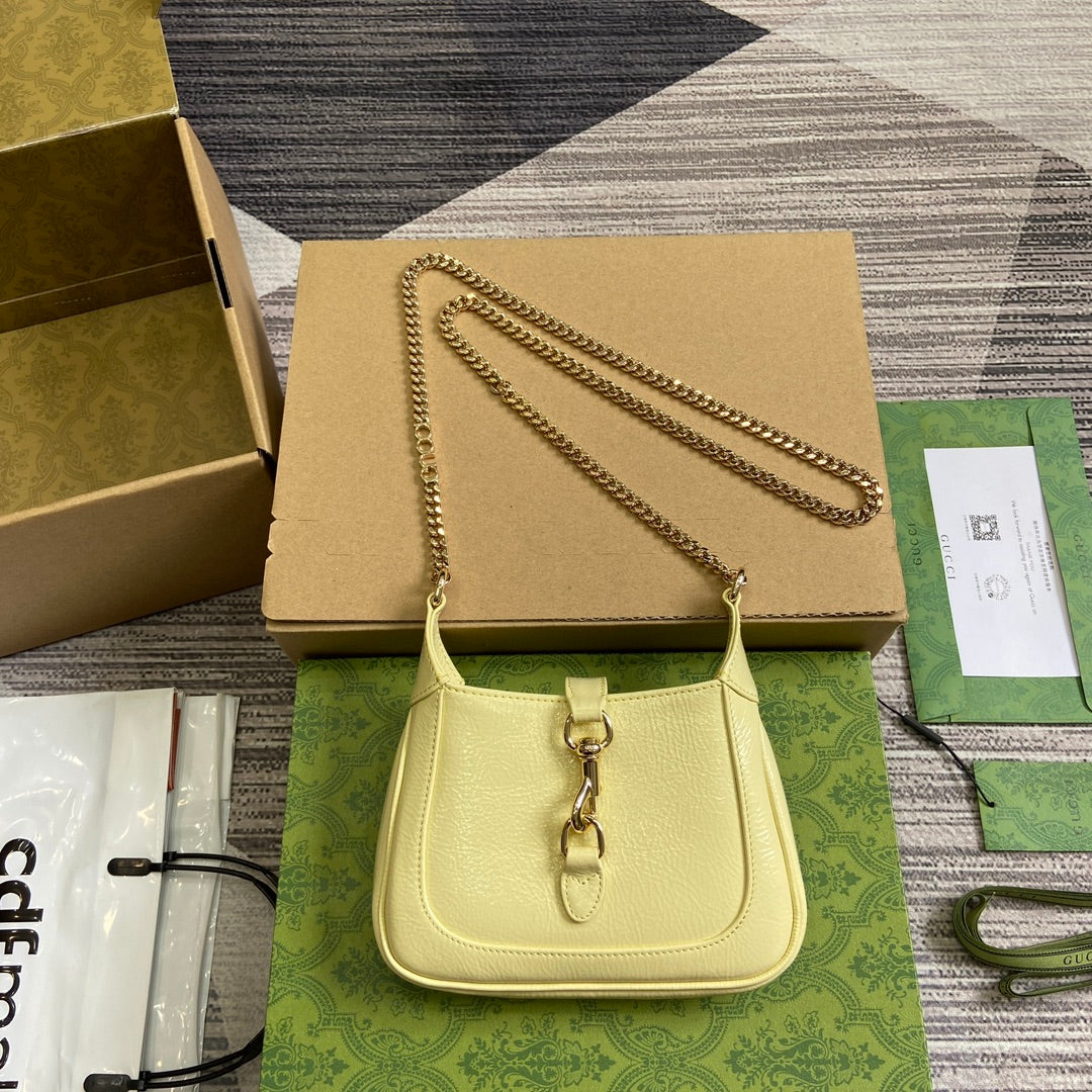 Luxury Gucci JACKIE NOTTE MINI BAG 19 IN LIGHT YELLOW CRACKED LACQUER CALFSKIN GOLD HARDWARE
