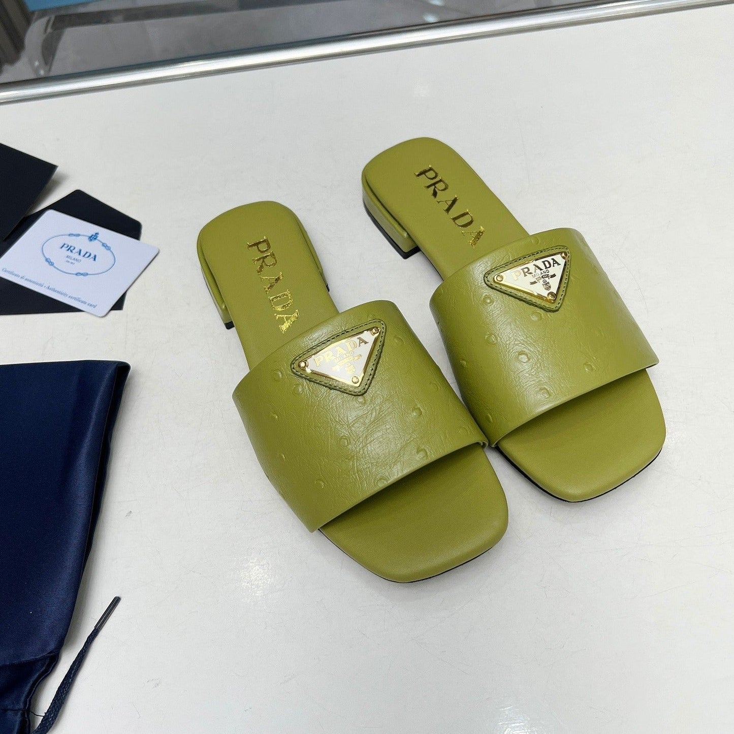 Luxury PradaSAFFIANO PATENT SLIDES OSTRICH MOTIF PEAR CALFSKIN