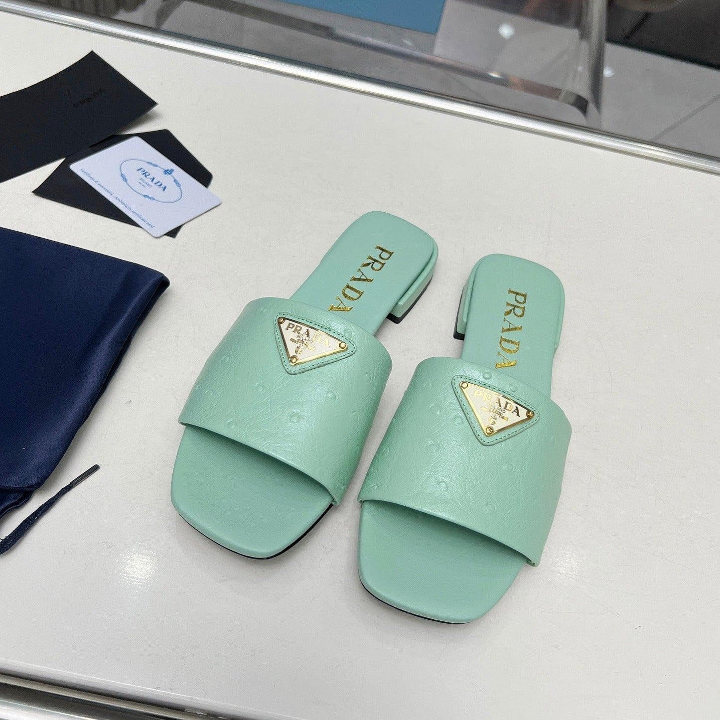 Luxury PradaSAFFIANO PATENT SLIDES OSTRICH MOTIF SEAFOAM CALFSKIN