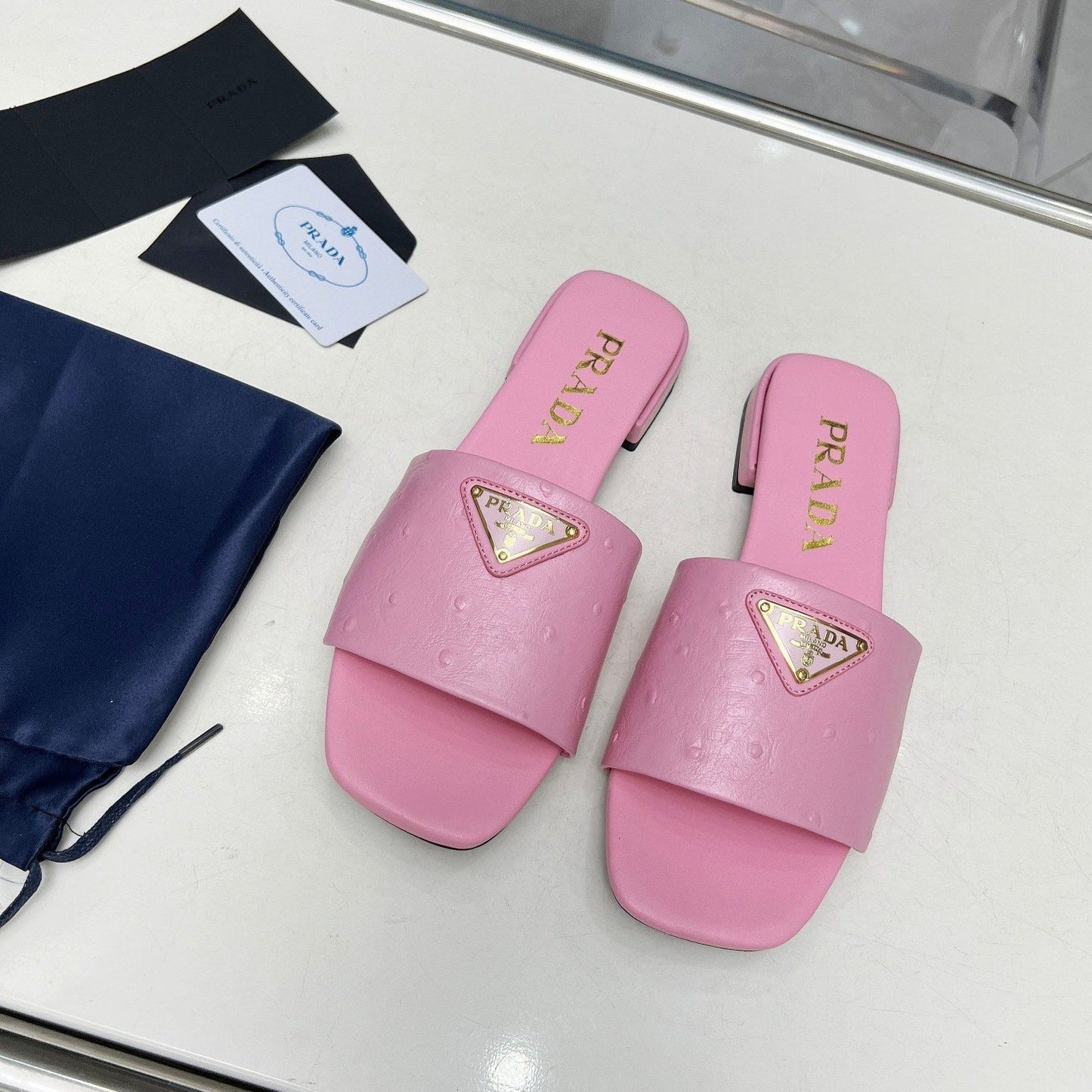 Luxury PradaSAFFIANO PATENT SLIDES OSTRICH MOTIF PINK CALFSKIN