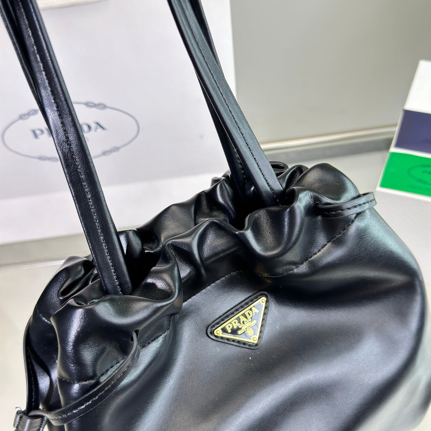 Luxury PradaDRAWSTRING BUCKET BAG 25 IN BLACK SOFT LAMBSKIN