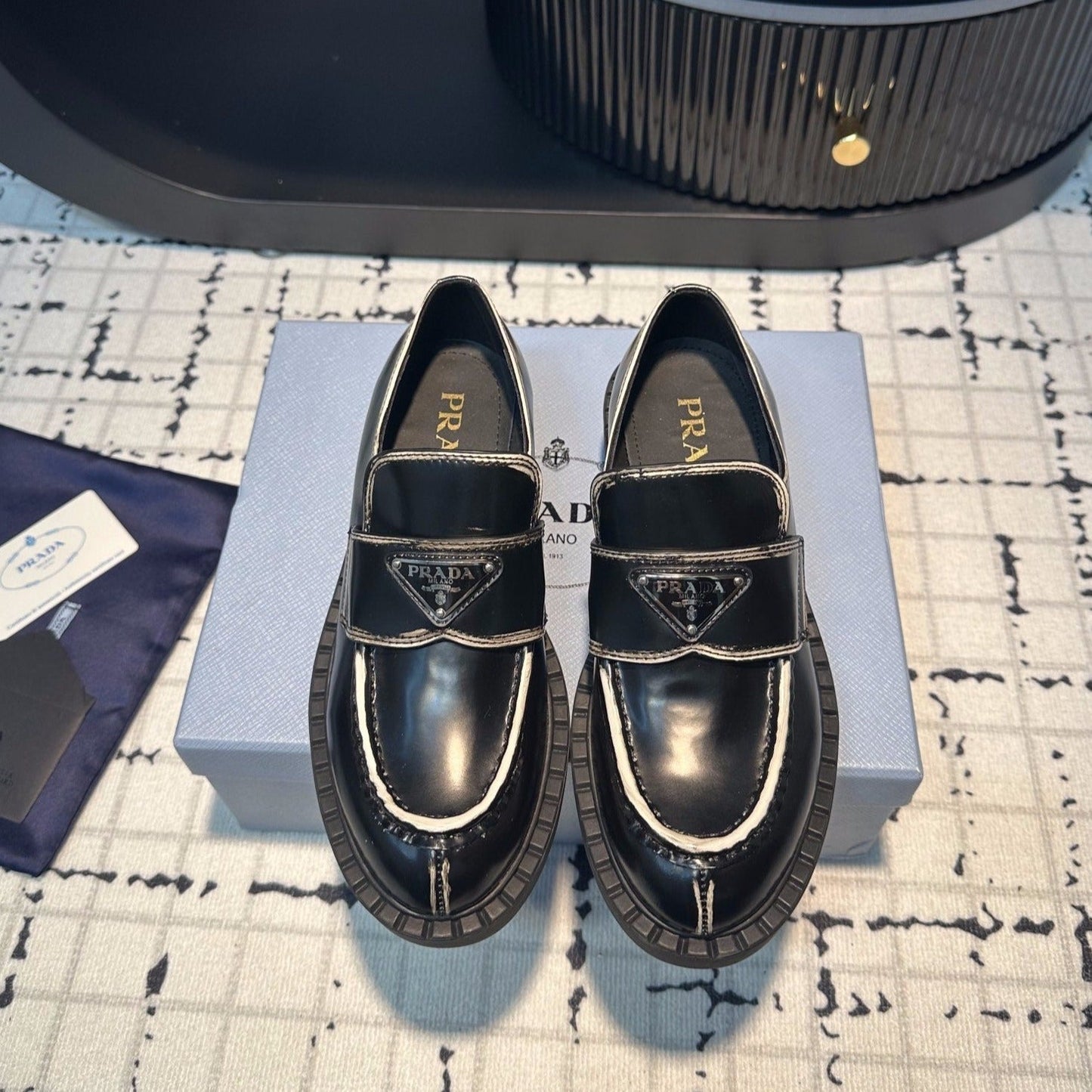 Luxury PradaSCHOCOLATE BRUSHED LOAFERS BLACK AND WHITE BORDER CALFSKIN