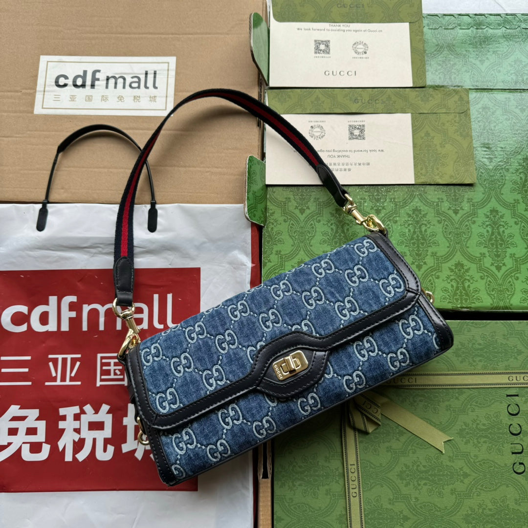 Luxury Gucci LUCE SMALL SHOULDER BAG 27 IN BLUE EMBOSSED DENIM AND BLACK CALFSKIN TRIM GOLD HARDWARE