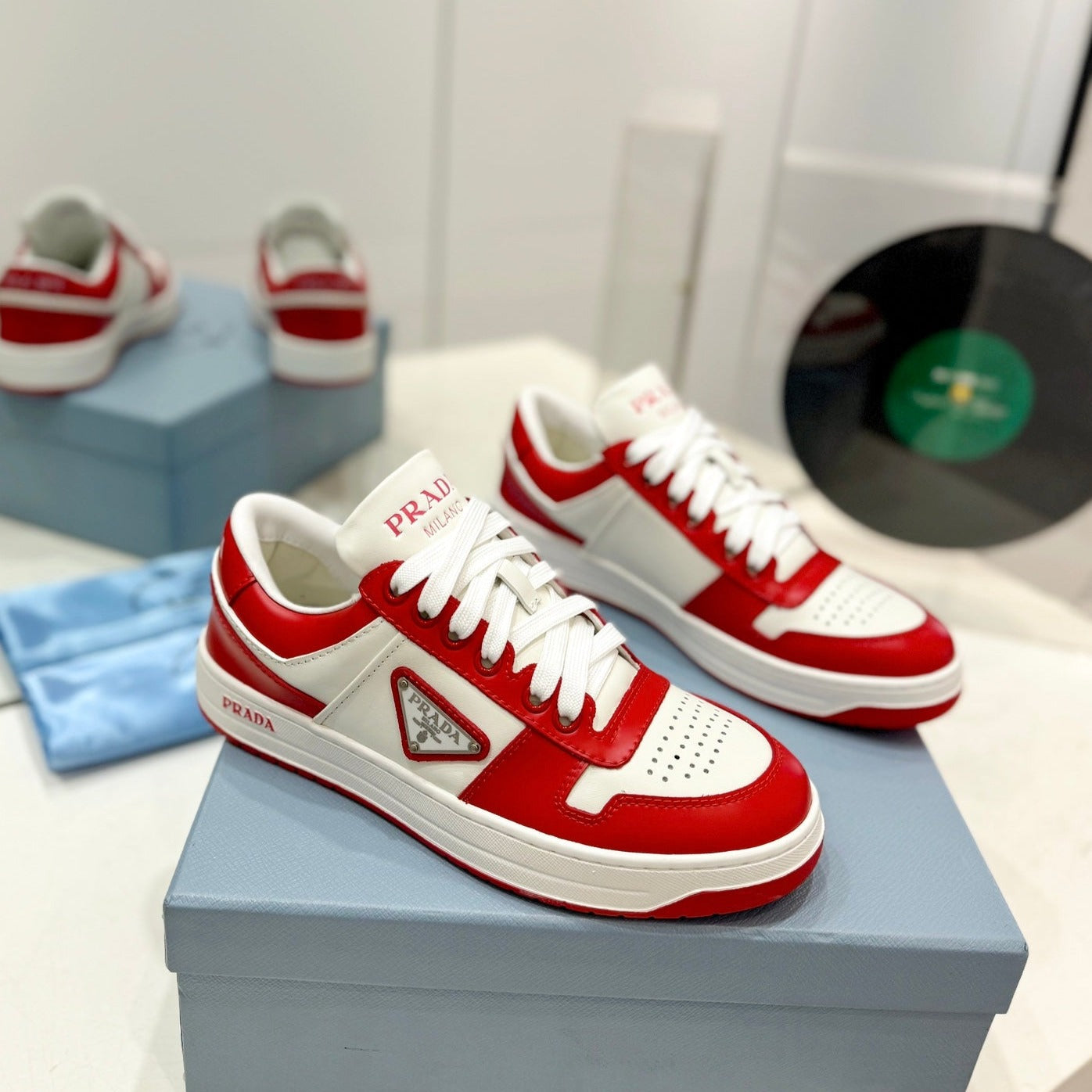 Luxury PradaDOWNTOWN PERFORATED SNEAKERS WHITE AND RED CALFSKIN
