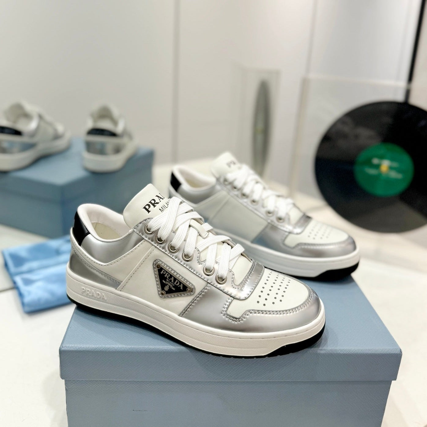 Luxury PradaDOWNTOWN PERFORATED SNEAKERS WHITE AND SILVER CALFSKIN